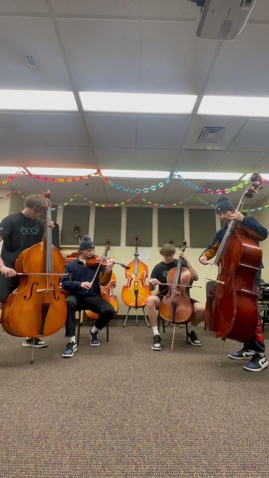 Cellos, violins and double basses being played in a recording room